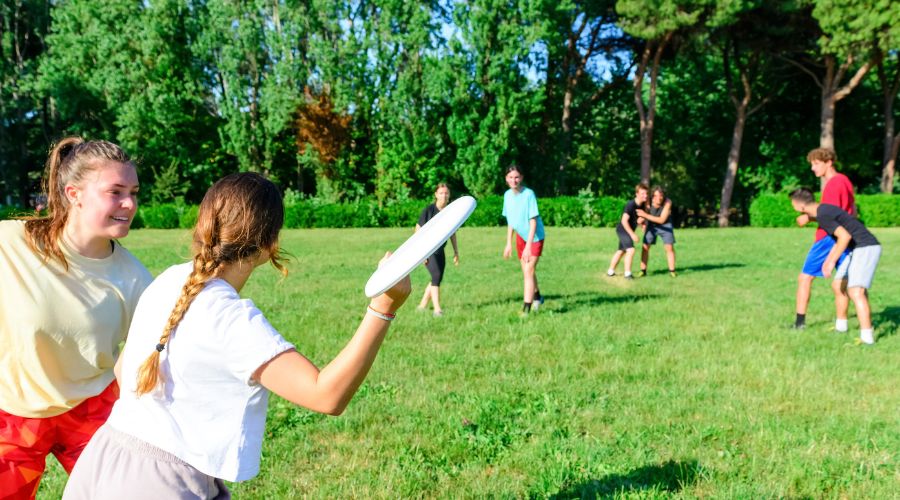 teens playing sports in a field in bergen county new jersey